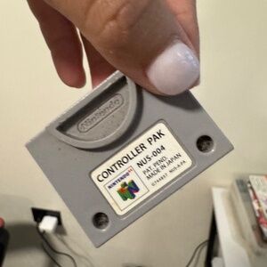 Original N64 Controller Pak (NUS-004), made in Japan. Classic gray design with w